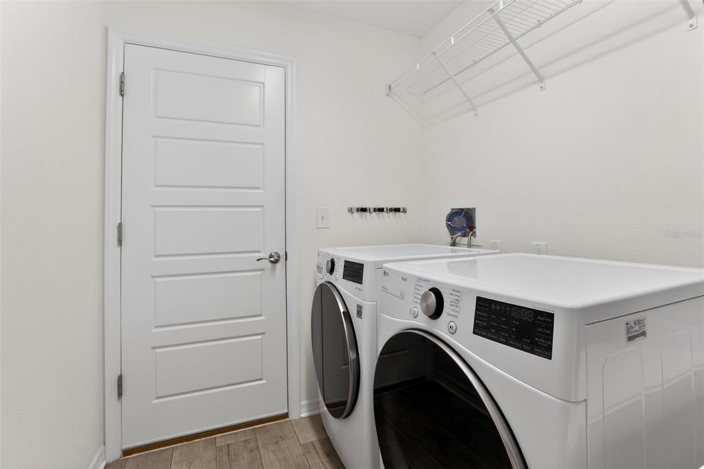 6273 Windham Way The Villages, FL 32163 - Photo 25 of 32 a utility room with dryer and washer