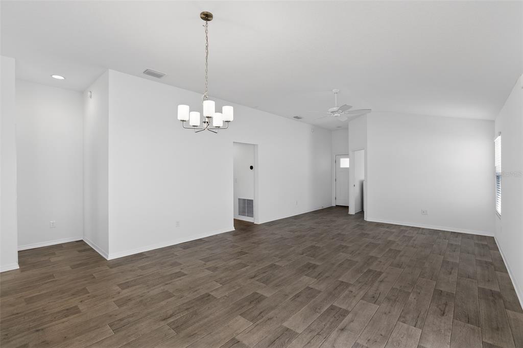 6273 Windham Way The Villages, FL 32163 - Photo 8 of 32 a view of a chandelier in big room and chandelier