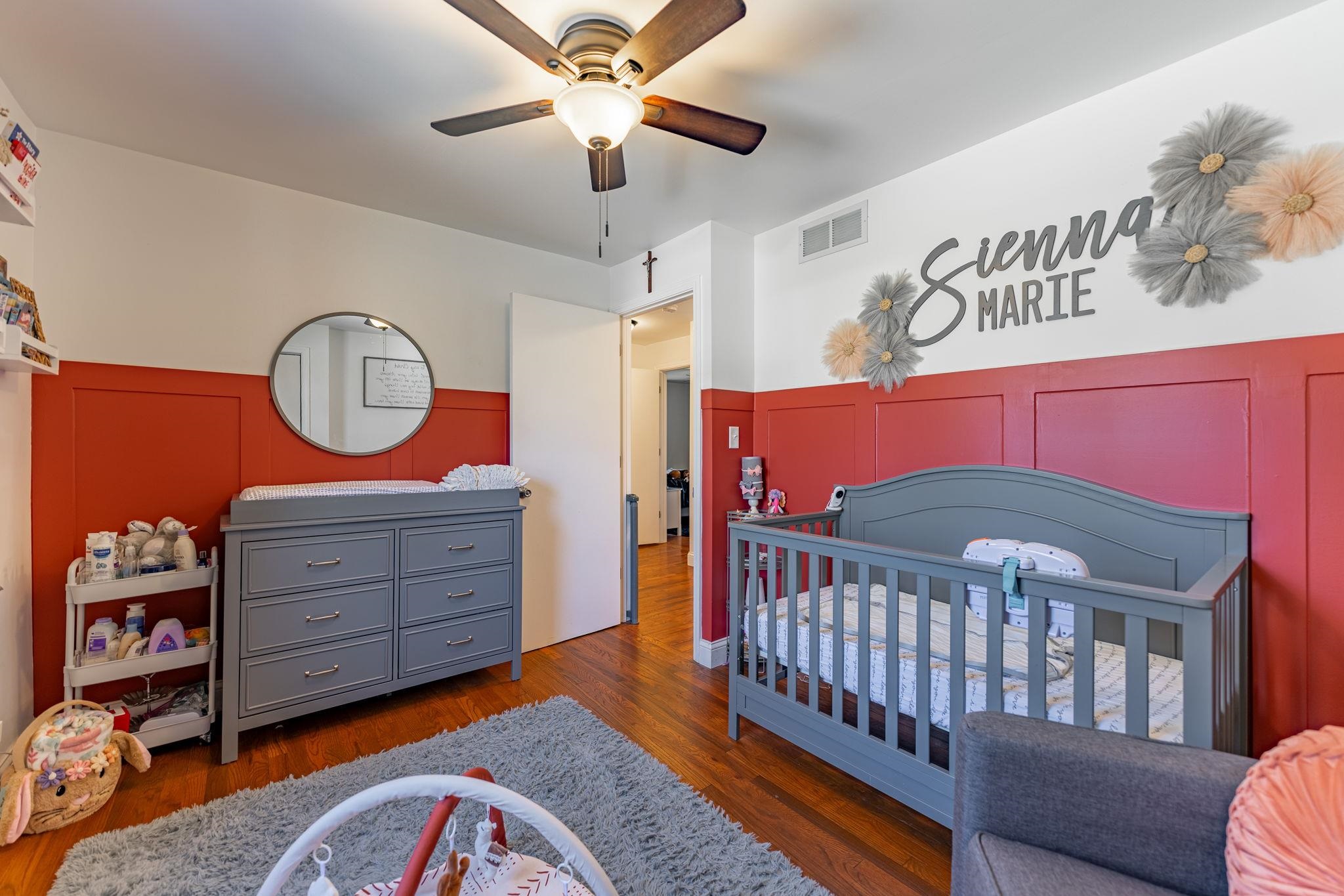 6912 Elevator Road Roscoe, IL 61073 - Photo 16 of 43 a bedroom with a bed and a chandelier