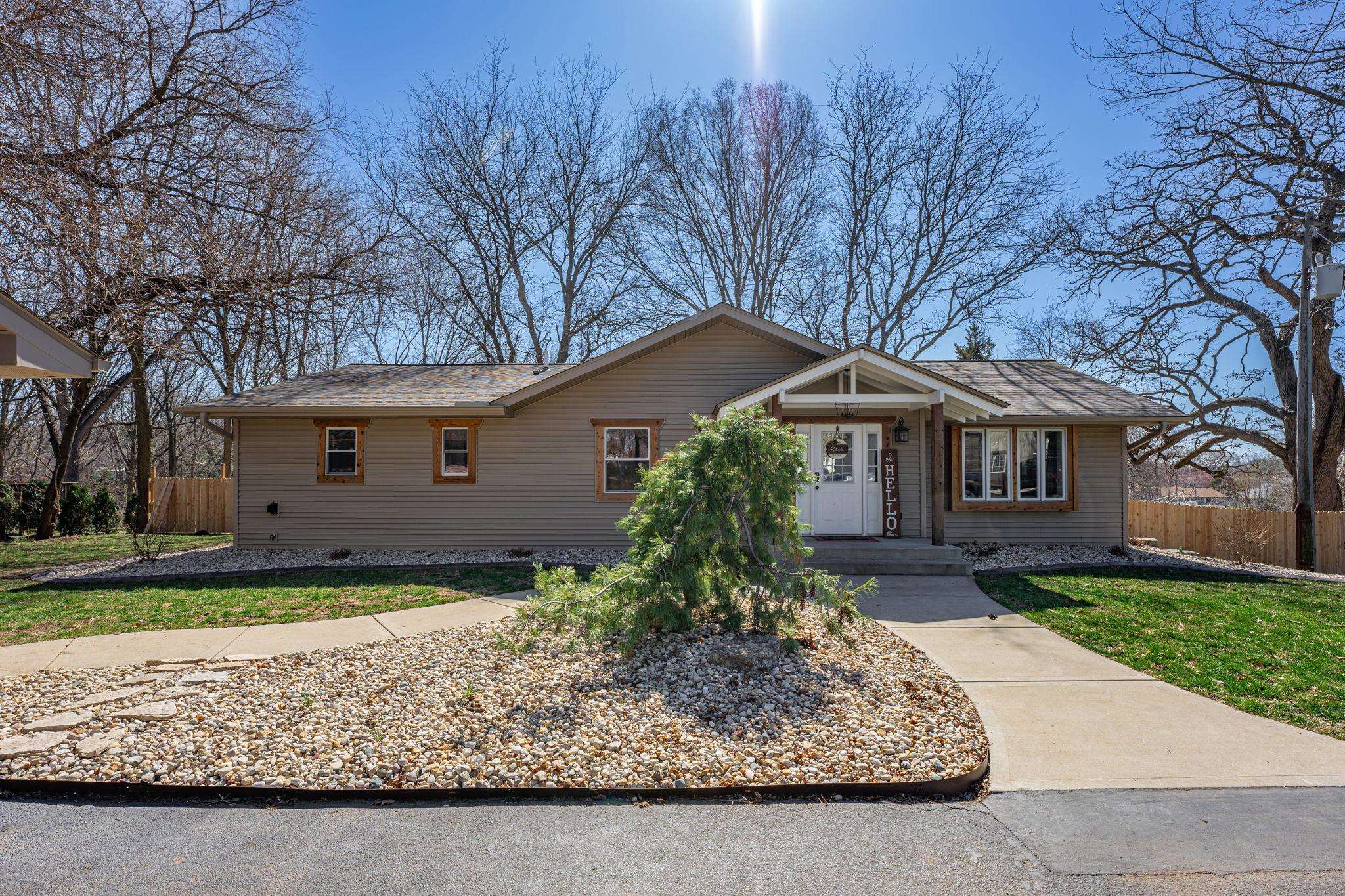 6912 Elevator Road Roscoe, IL 61073 - Photo 3 of 43 a house that has a tree in front of it