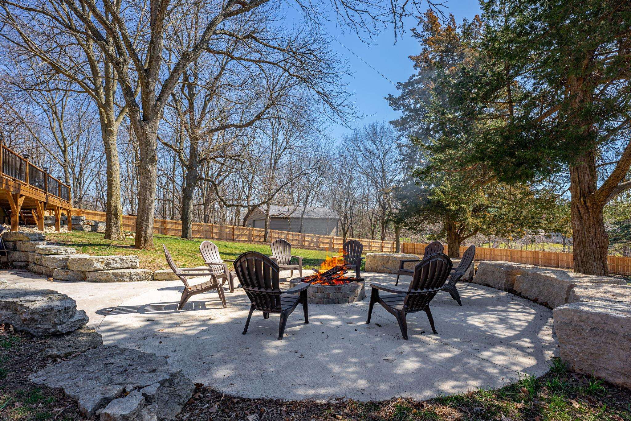 6912 Elevator Road Roscoe, IL 61073 - Photo 31 of 43 a swimming pool with outdoor seating and trees