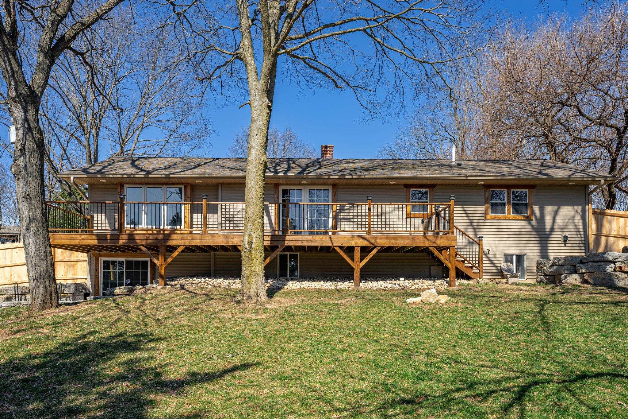 6912 Elevator Road Roscoe, IL 61073 - Photo 33 of 43 a front view of a house with garden