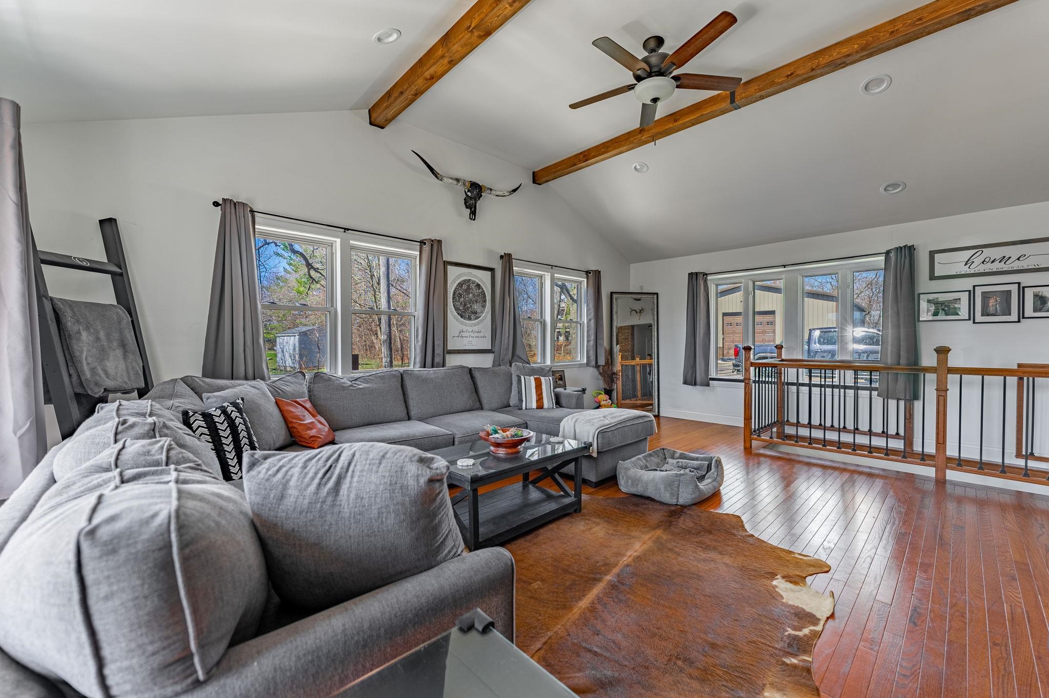 6912 Elevator Road Roscoe, IL 61073 - Photo 8 of 43 a living room with furniture and a window