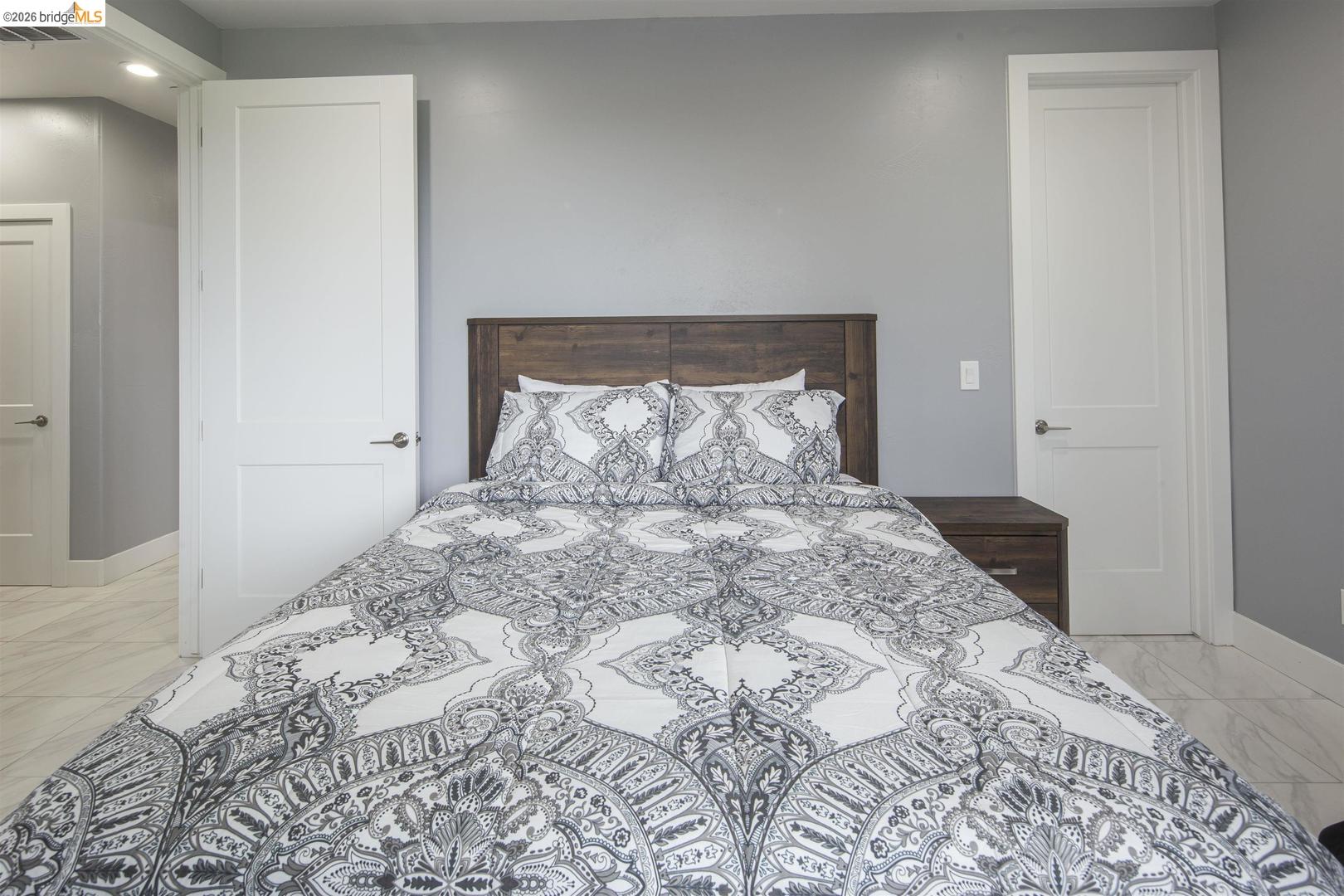 4626 Little John Road Copperopolis, CA 95228 - Photo 46 of 53 a bedroom with a bed and a window