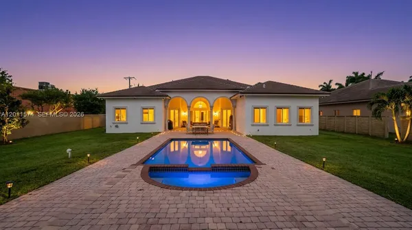 a view of a house with a yard