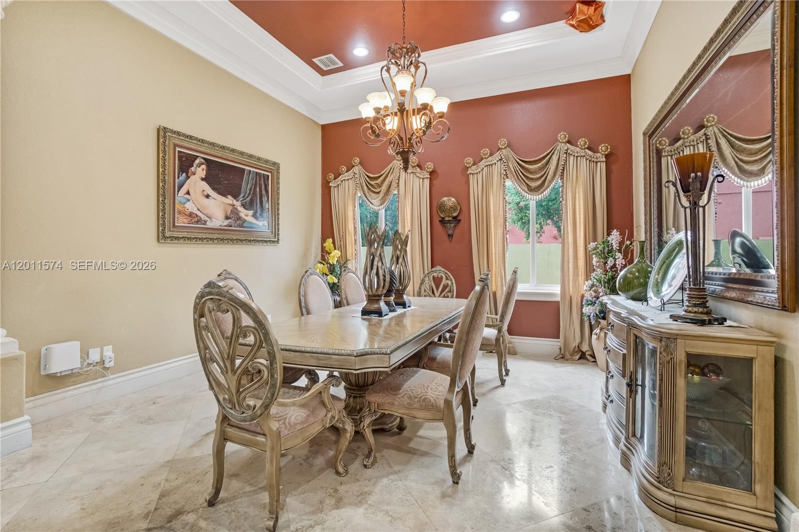 4025 Southwest 128th Avenue Miami, FL 33175 - Photo 12 of 93 a view of a dining room with furniture and a chandelier