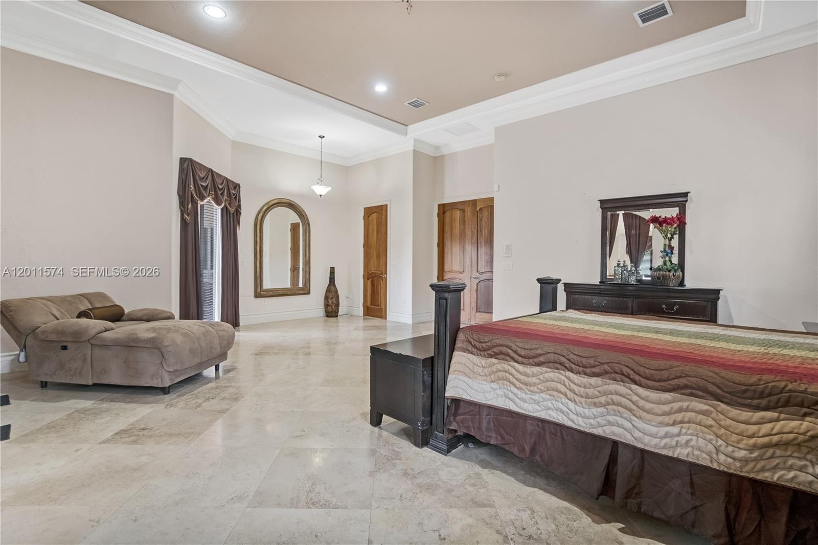 4025 Southwest 128th Avenue Miami, FL 33175 - Photo 15 of 93 a bedroom with a large bed and a large mirror