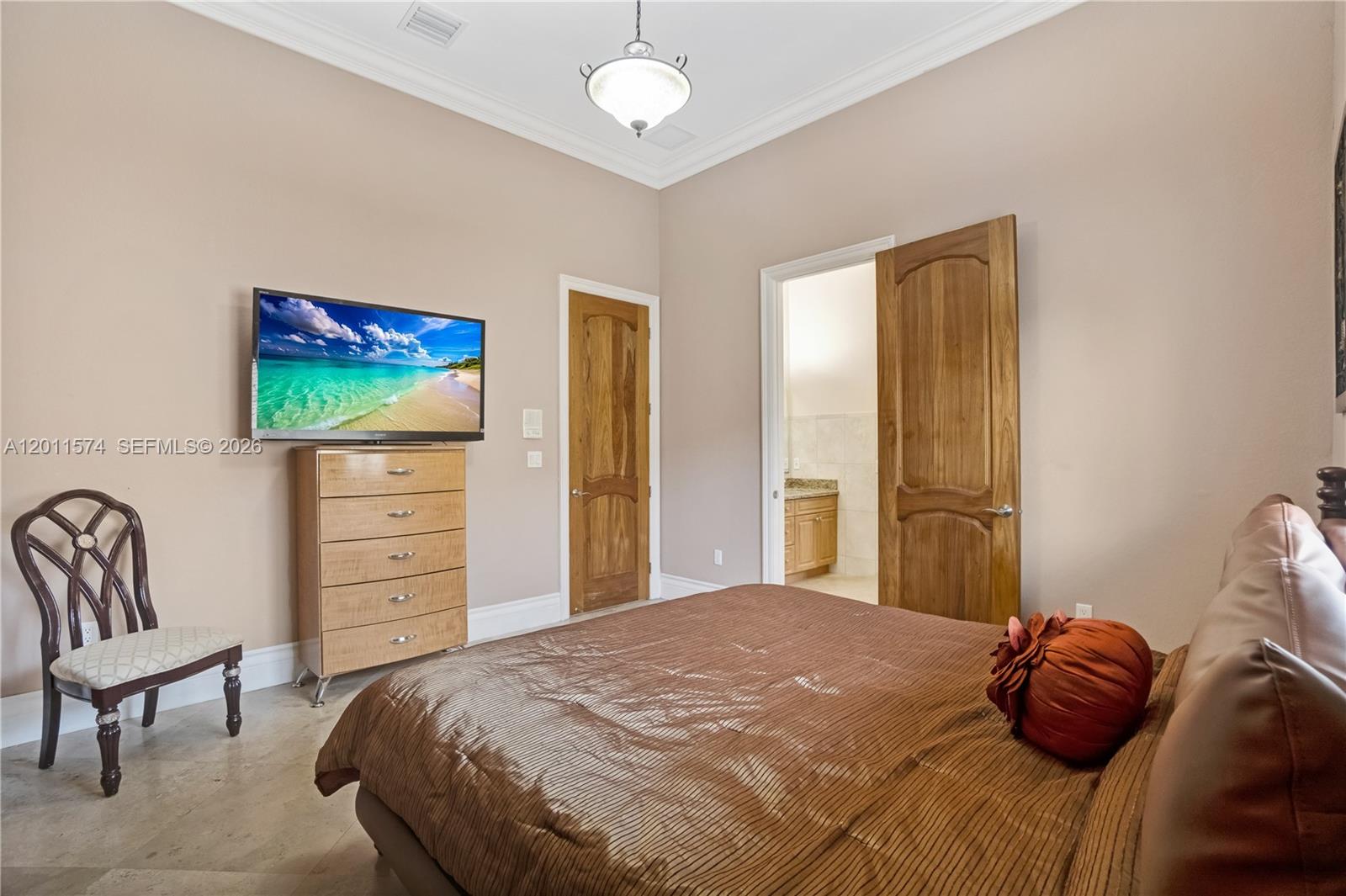 4025 Southwest 128th Avenue Miami, FL 33175 - Photo 23 of 93 a bedroom with a bed and a chandelier