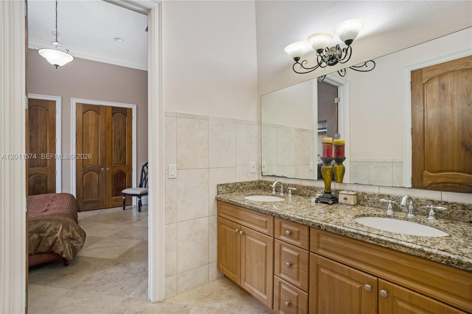 4025 Southwest 128th Avenue Miami, FL 33175 - Photo 27 of 93 a en suite bathroom with a granite countertop double vanity sink and a mirror