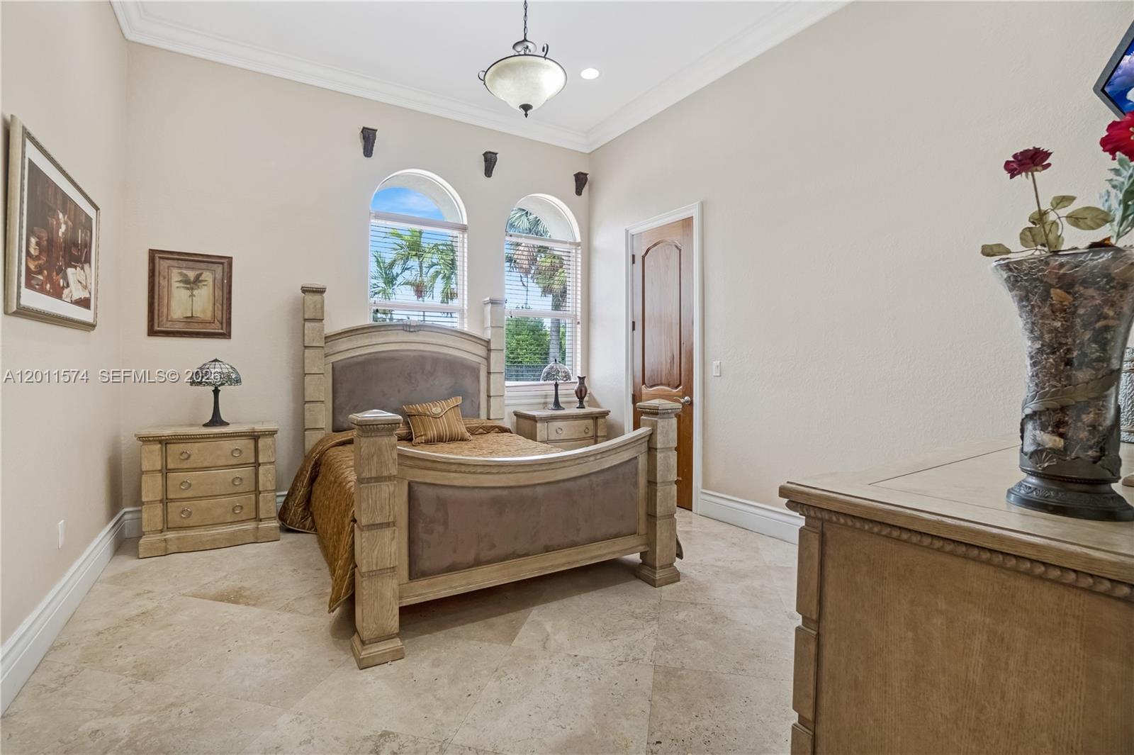4025 Southwest 128th Avenue Miami, FL 33175 - Photo 33 of 93 a living room with furniture and a chandelier