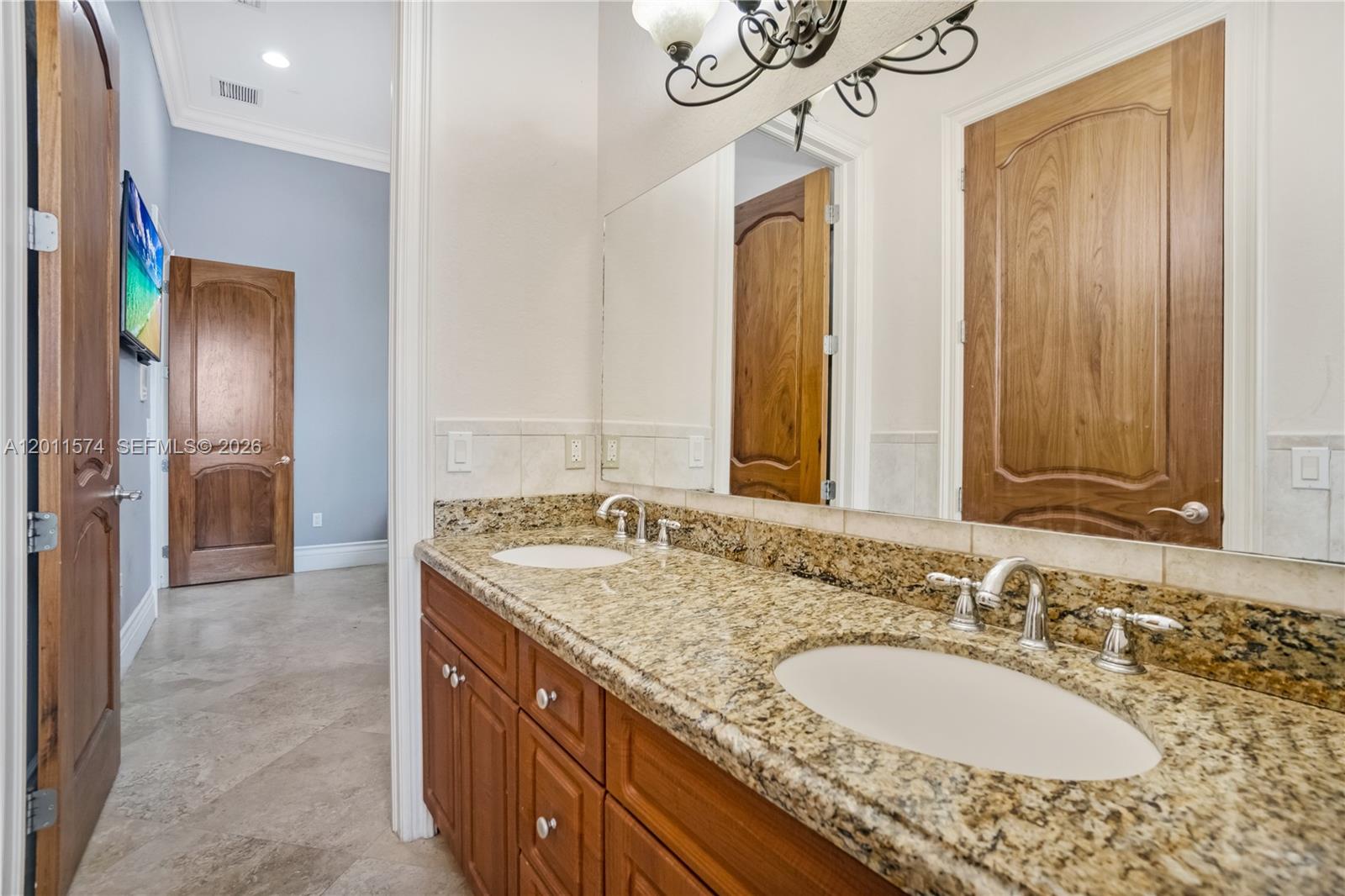 4025 Southwest 128th Avenue Miami, FL 33175 - Photo 37 of 93 a bathroom with a granite countertop double vanity sink and a mirror