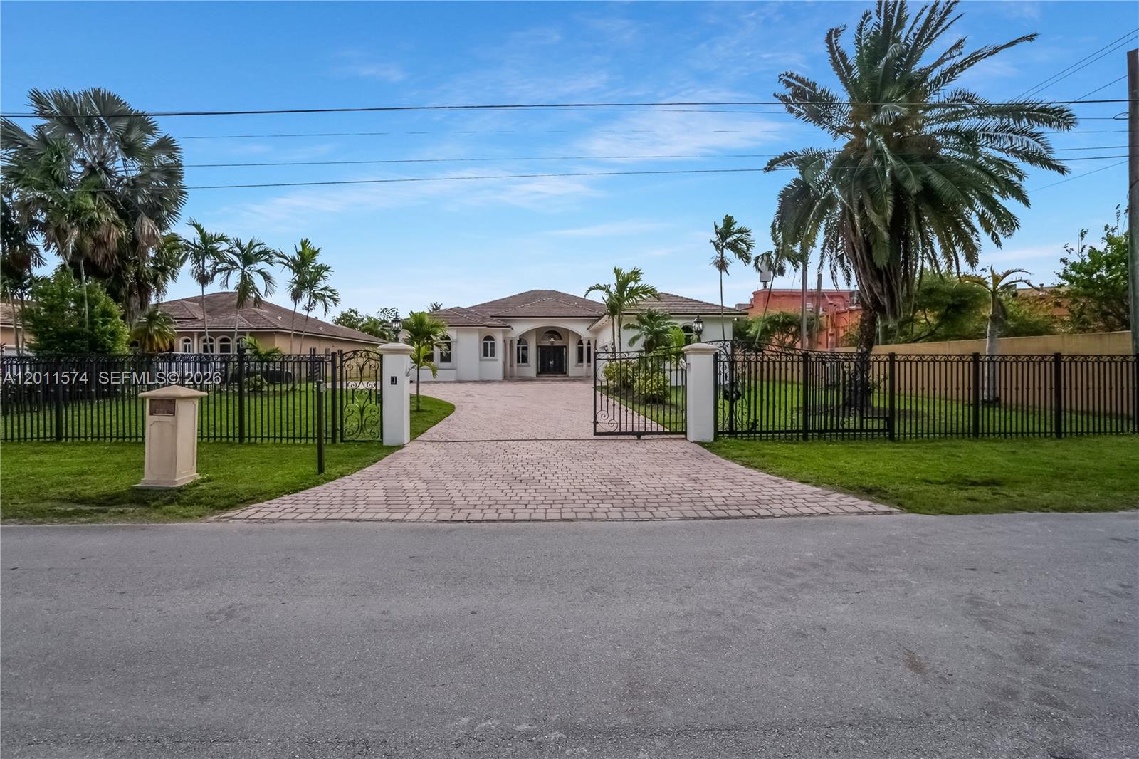 4025 Southwest 128th Avenue Miami, FL 33175 - Photo 4 of 93 a view of a house with a yard and palm trees