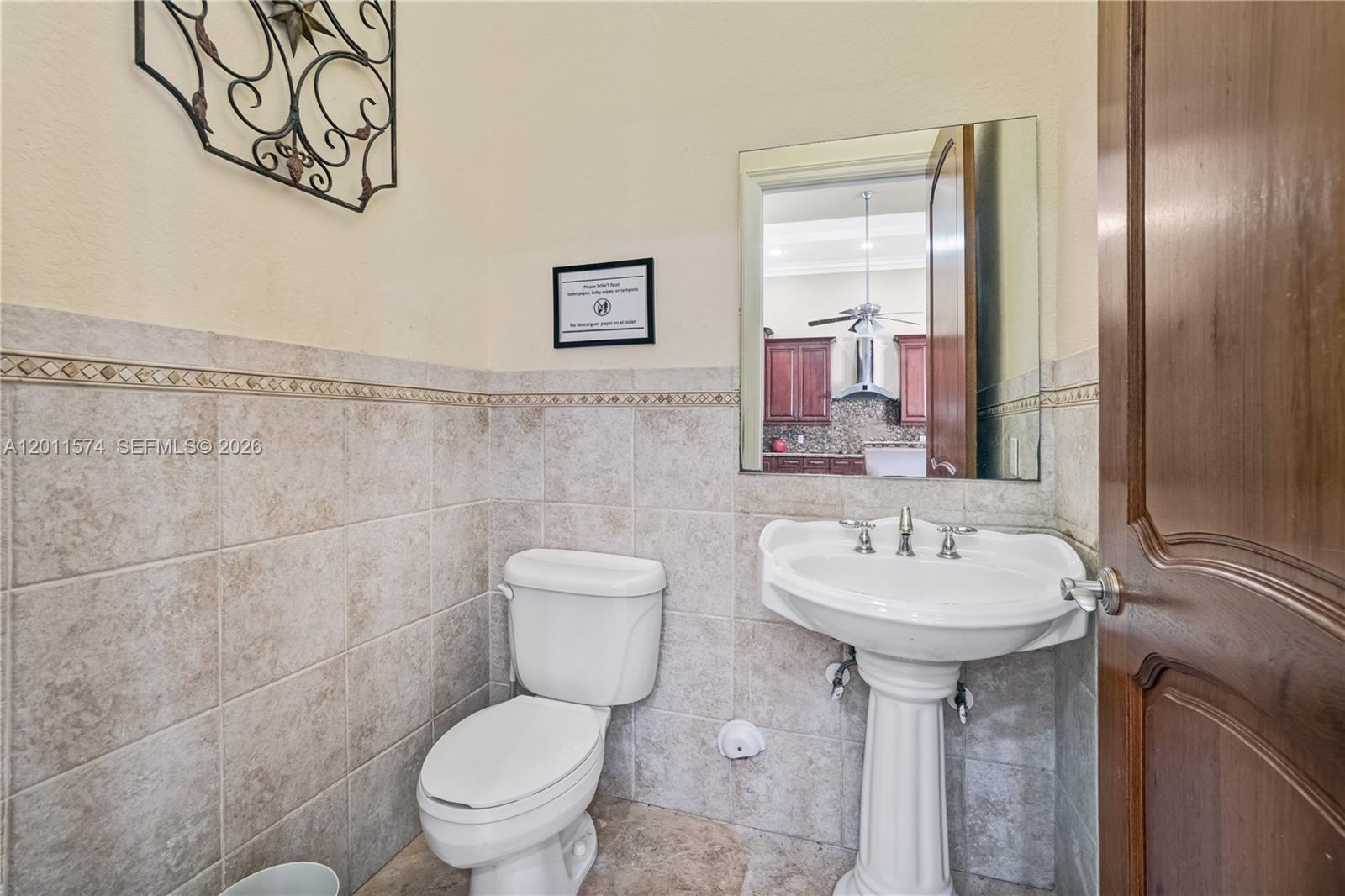 4025 Southwest 128th Avenue Miami, FL 33175 - Photo 45 of 93 a bathroom with a toilet sink and mirror