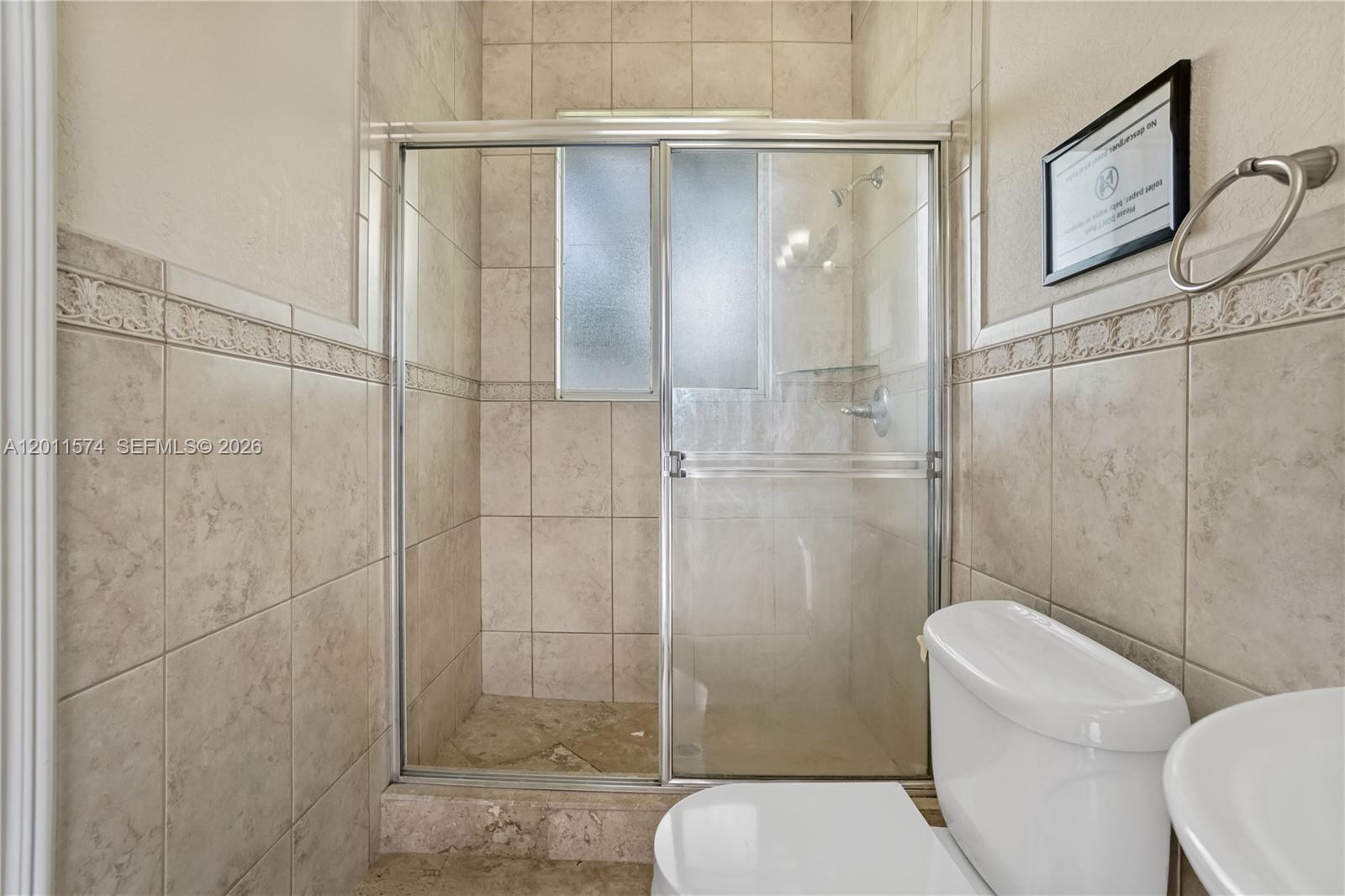 4025 Southwest 128th Avenue Miami, FL 33175 - Photo 49 of 93 a bathroom with a toilet and shower