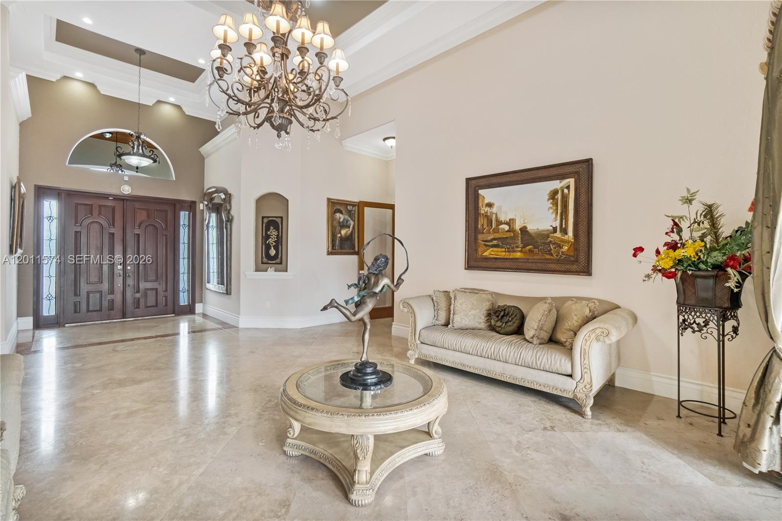4025 Southwest 128th Avenue Miami, FL 33175 - Photo 57 of 93 a living room with furniture and a chandelier