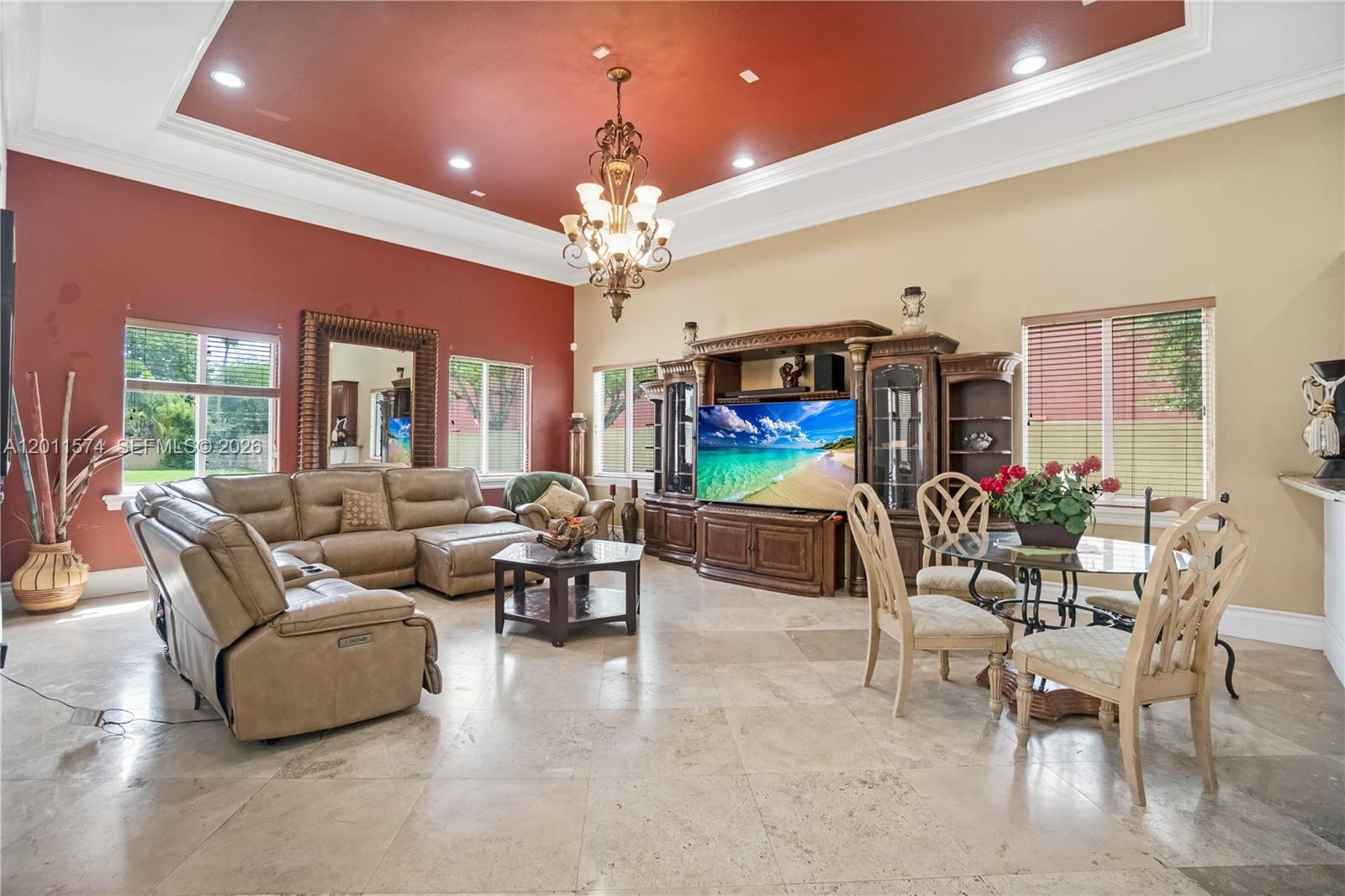 4025 Southwest 128th Avenue Miami, FL 33175 - Photo 59 of 93 a living room with furniture a flat screen tv and a chandelier