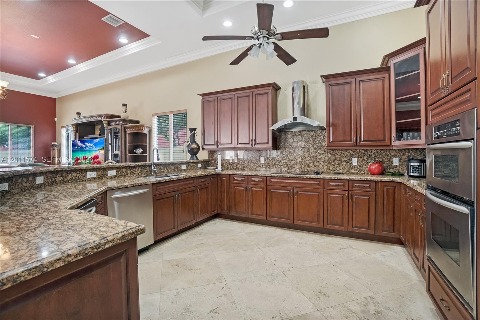 4025 Southwest 128th Avenue Miami, FL 33175 - Photo 7 of 93 a kitchen with stainless steel appliances granite countertop a sink counter space cabinets and a large window