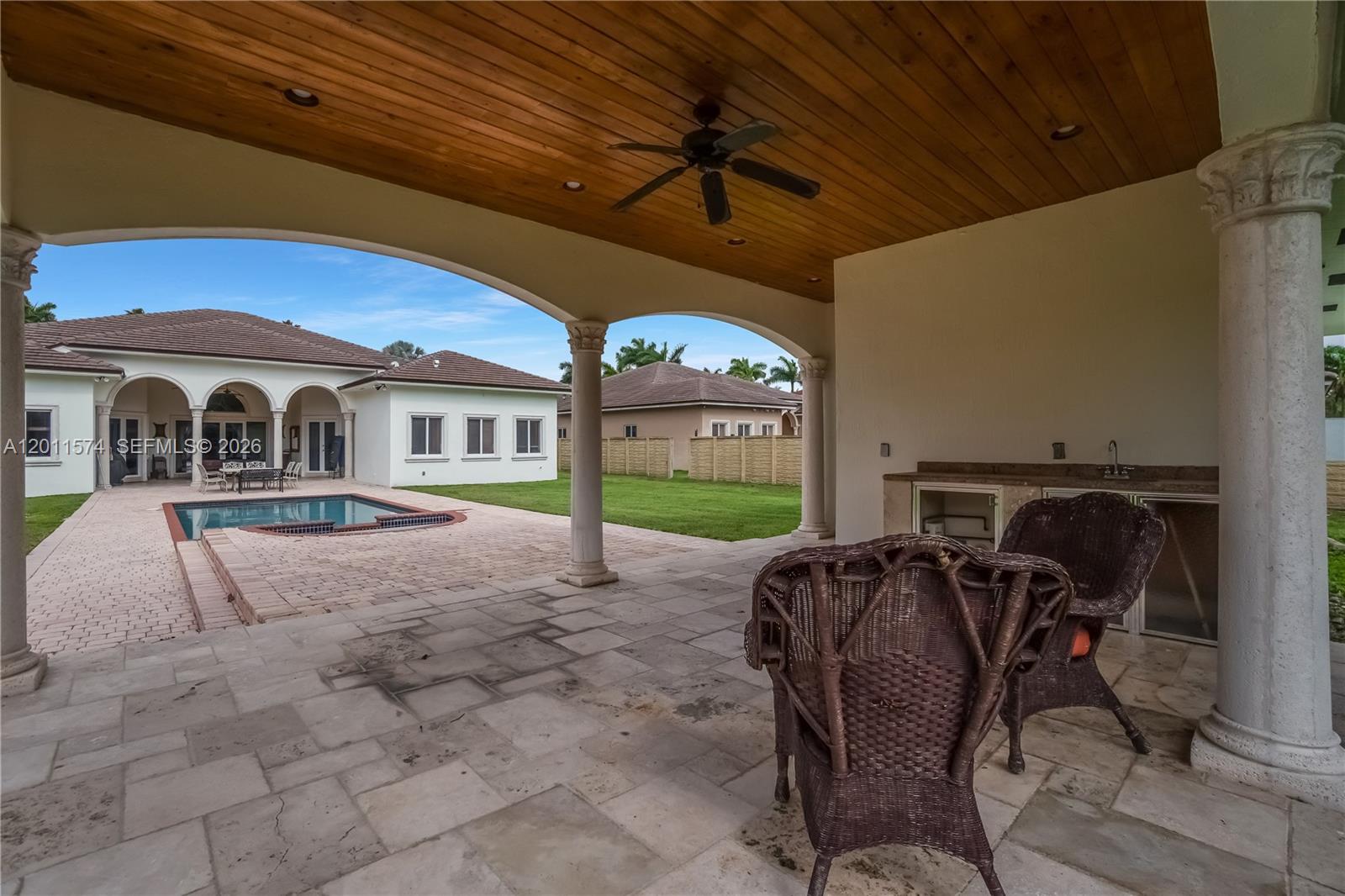 4025 Southwest 128th Avenue Miami, FL 33175 - Photo 73 of 93 a view of a porch with chairs and a yard