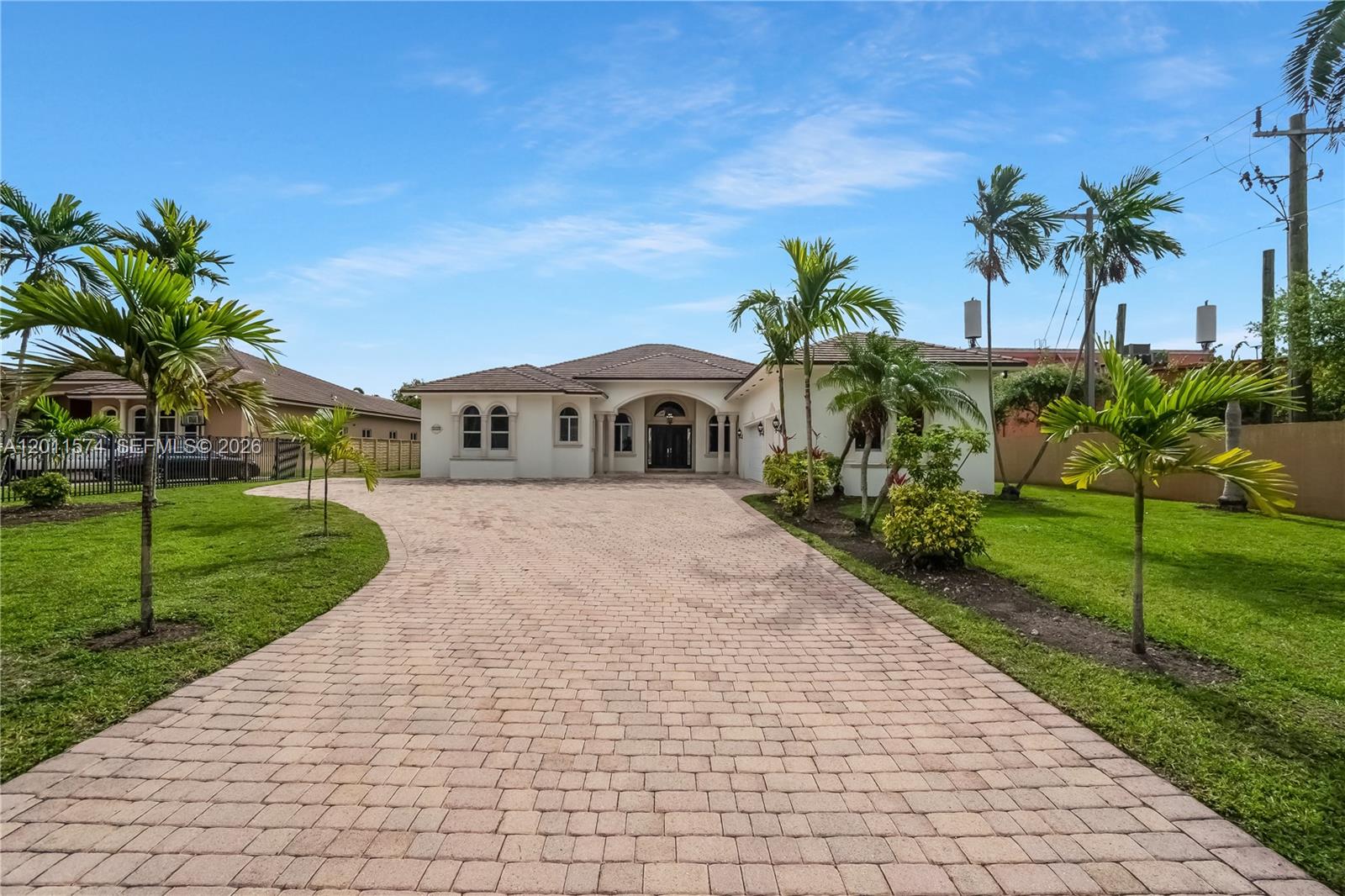 4025 Southwest 128th Avenue Miami, FL 33175 - Photo 83 of 93 a front view of a house with a yard and potted plants
