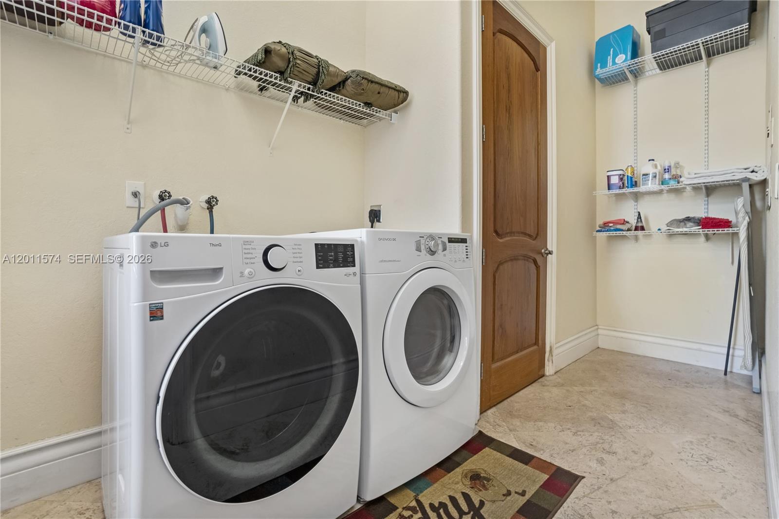 4025 Southwest 128th Avenue Miami, FL 33175 - Photo 90 of 93 a view of a storage & utility room with washer and dryer