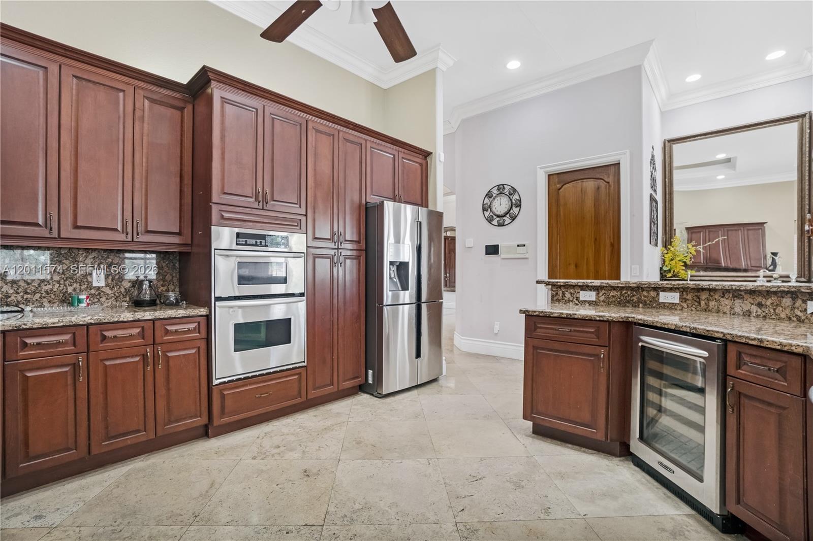 4025 Southwest 128th Avenue Miami, FL 33175 - Photo 10 of 93 a kitchen with stainless steel appliances granite countertop a refrigerator and a sink