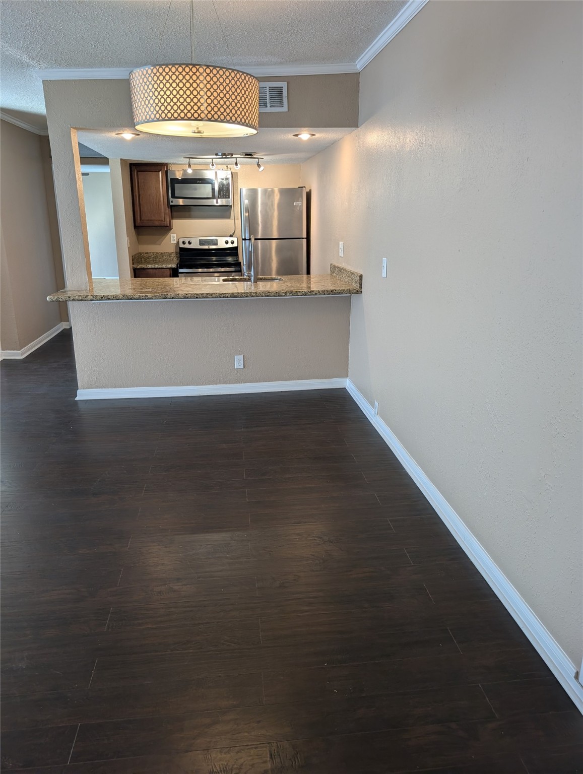 2503 McCue Road, Unit 37 Houston, TX 77056 - Photo 11 of 18 a view of a kitchen with a sink stove and microwave