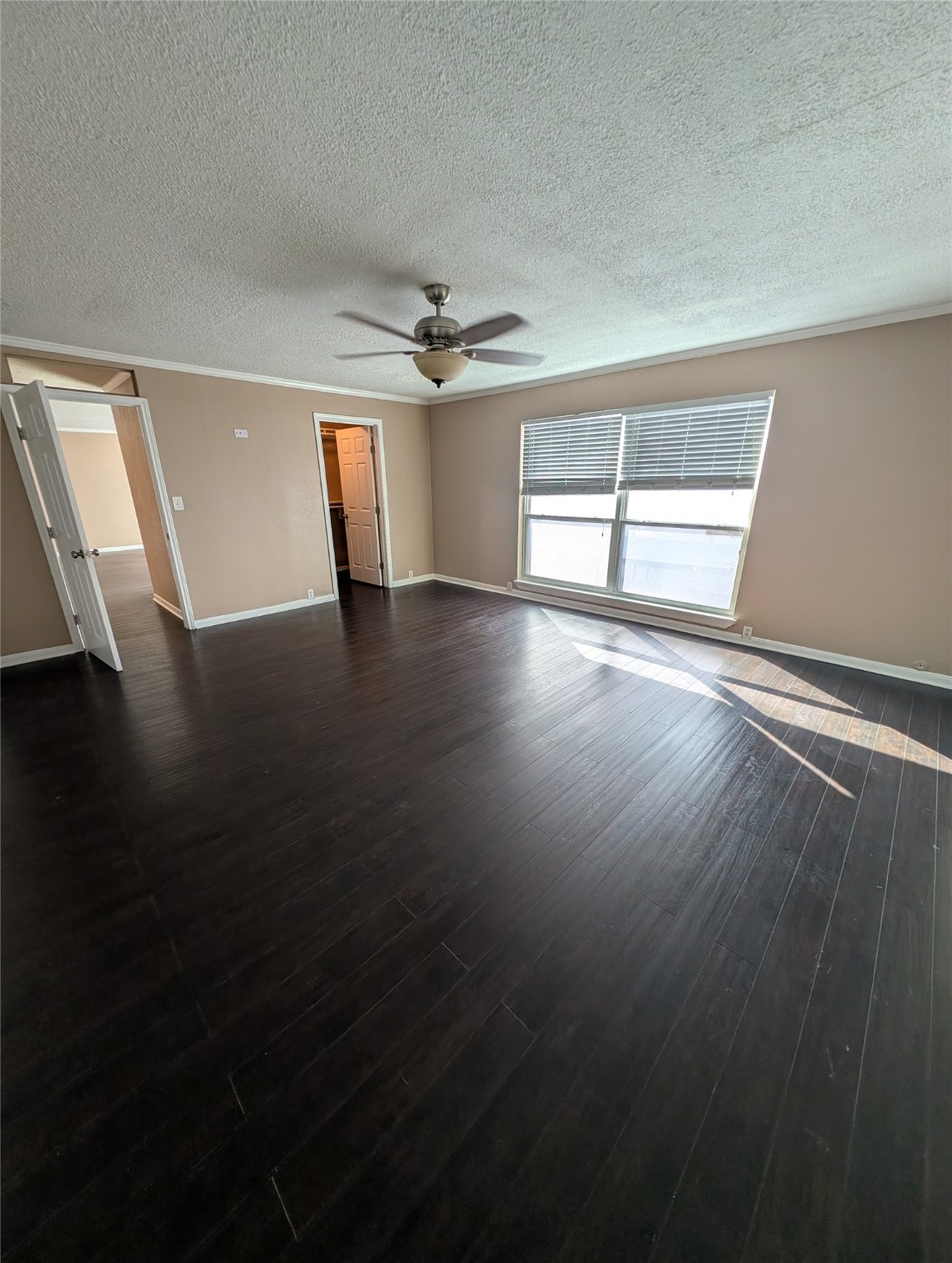 2503 McCue Road, Unit 37 Houston, TX 77056 - Photo 7 of 18 wooden floor in an empty room with a window