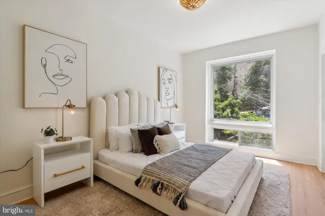 a bedroom with bed and a window