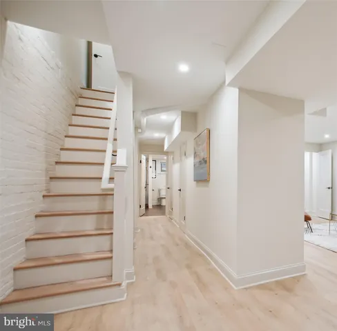 a view of entryway with stairs and white walls
