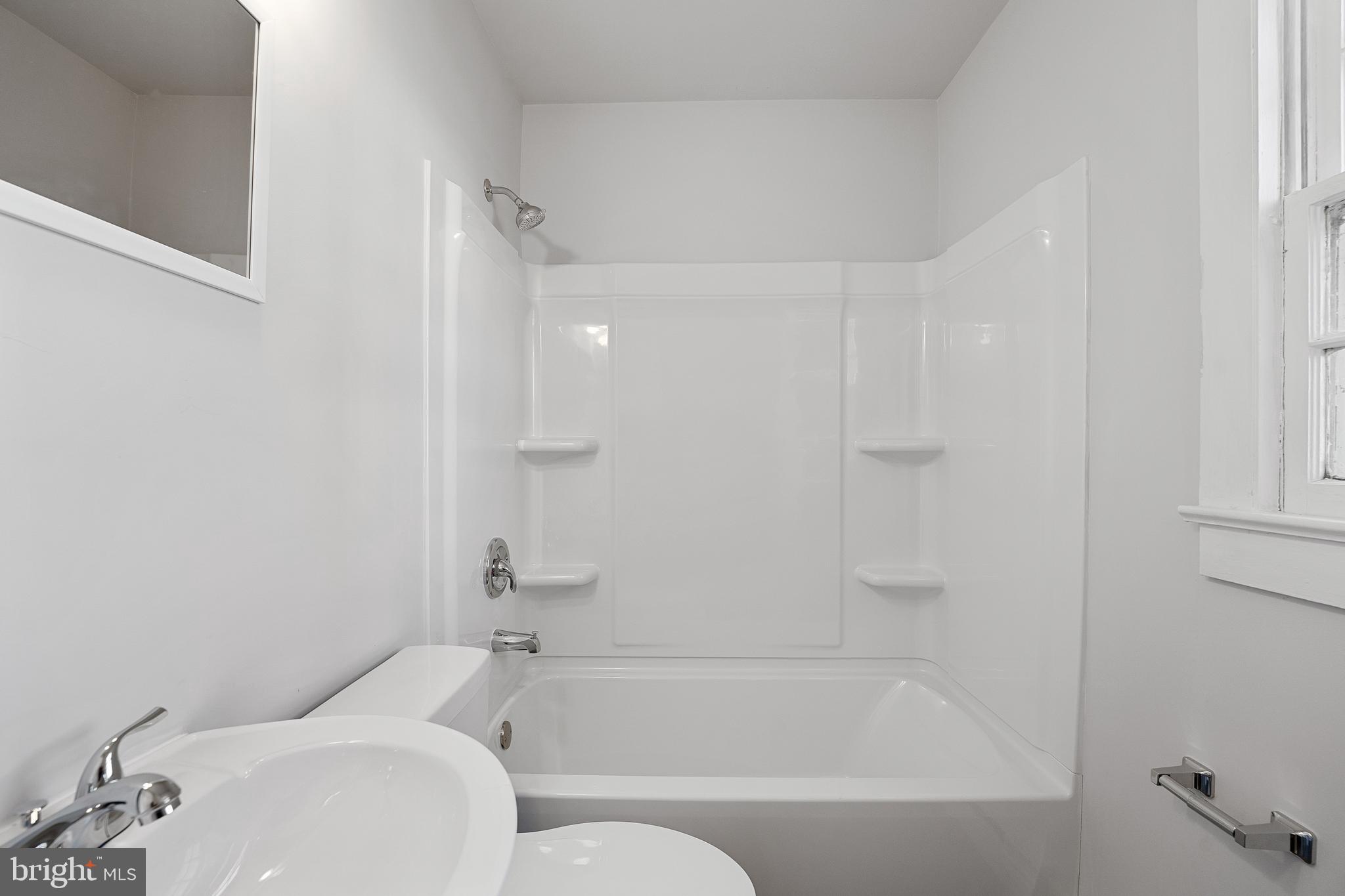 1117 Caroline Street, Unit E Fredericksburg, VA 22401 - Photo 12 of 17 a bathroom with a bathtub and a shower