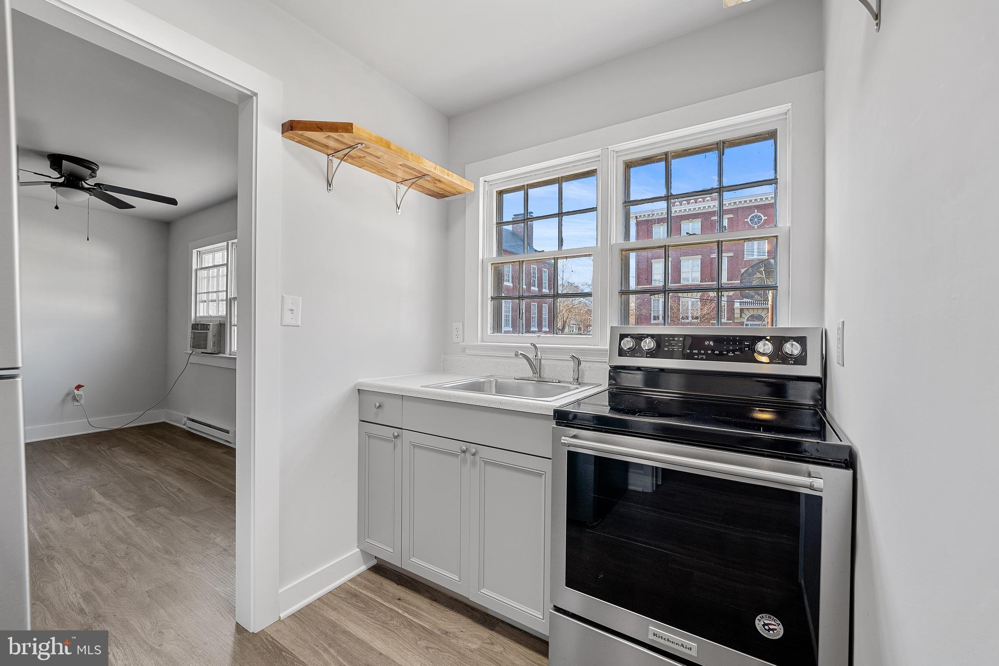 1117 Caroline Street, Unit E Fredericksburg, VA 22401 - Photo 10 of 17 a view of kitchen and utility room