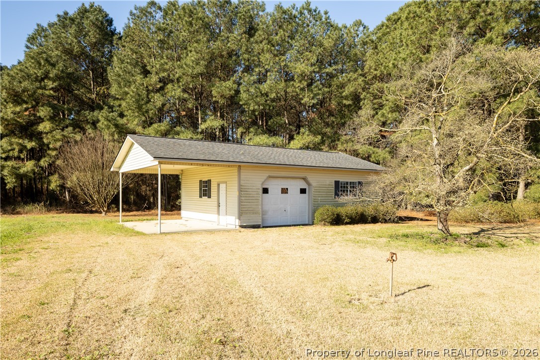 5424 Bonnetsville Road Clinton, NC 28328 - Photo 23 of 29 a house that has a big yard