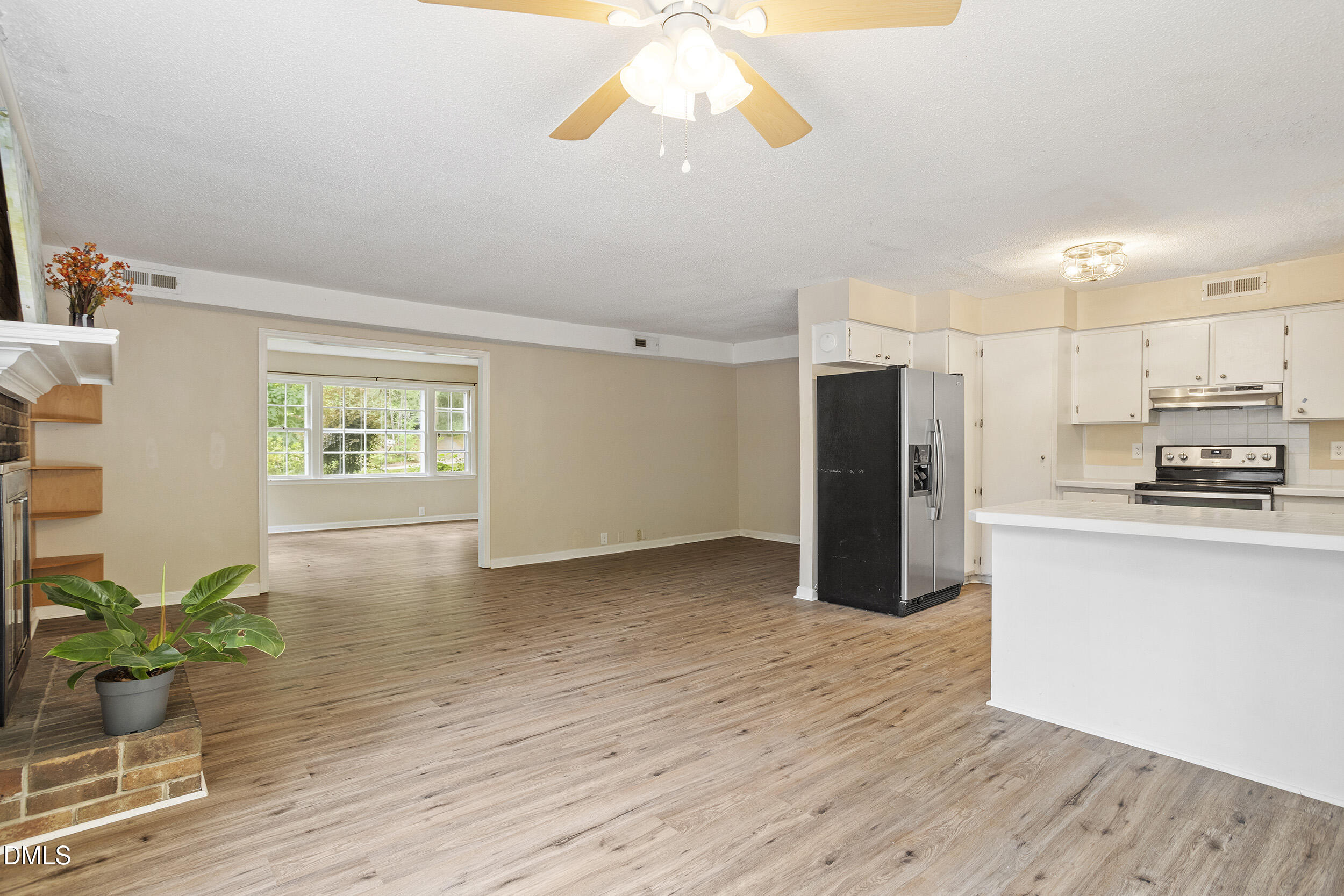 1801 Quail Ridge Road Raleigh, NC 27609 - Photo 13 of 29 a view of a kitchen with wooden floor and a window