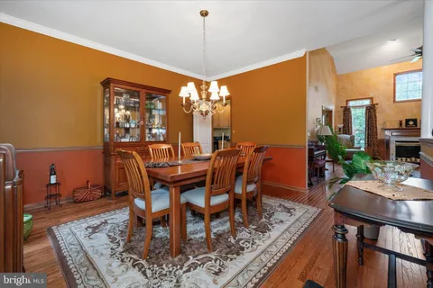 a dining room with furniture window wooden floor