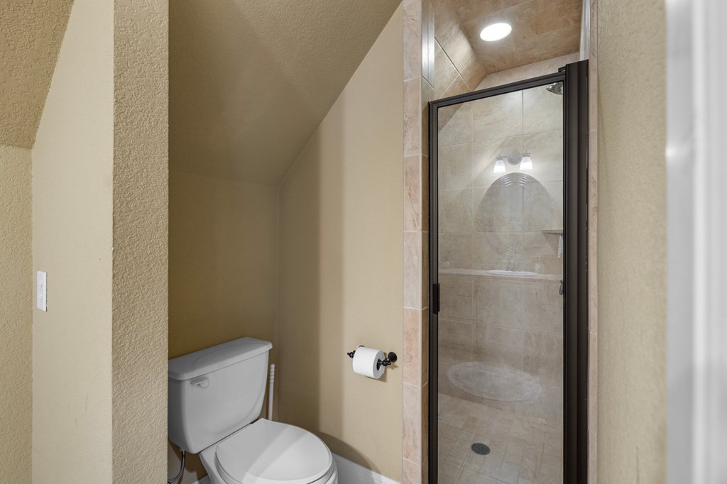 151 Kerr Canyon Pass South Kerrville, TX 78028 - Photo 23 of 45 a white toilet next to a bathroom sink