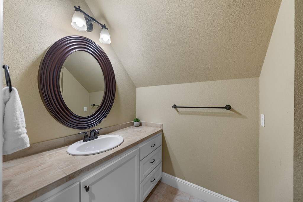 151 Kerr Canyon Pass South Kerrville, TX 78028 - Photo 24 of 45 a bathroom with a sink and a mirror