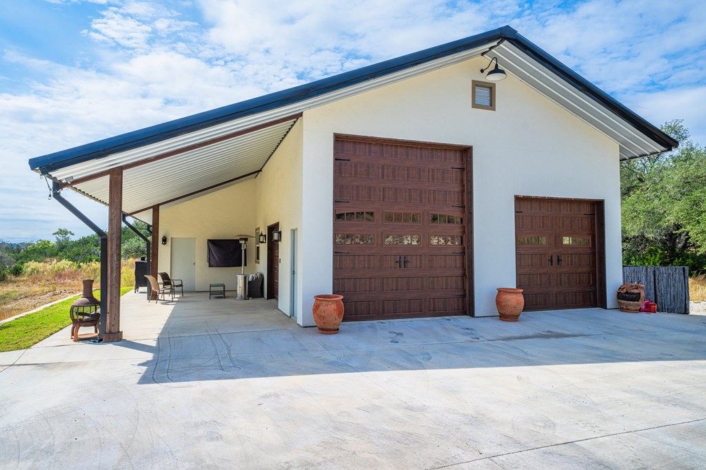 151 Kerr Canyon Pass South Kerrville, TX 78028 - Photo 33 of 45 a view of a house with a patio
