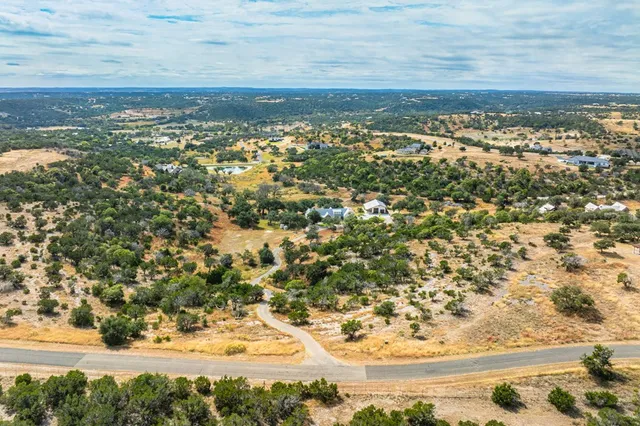 a view of a swimming pool with a yard