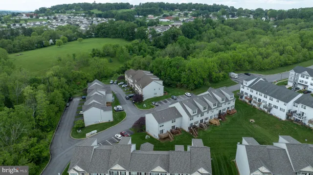 an aerial view of a house with a garden