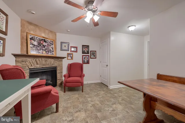 a view of a livingroom with furniture and a fireplace