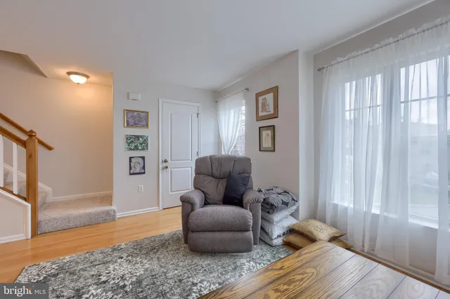 a bedroom with furniture and wooden floor