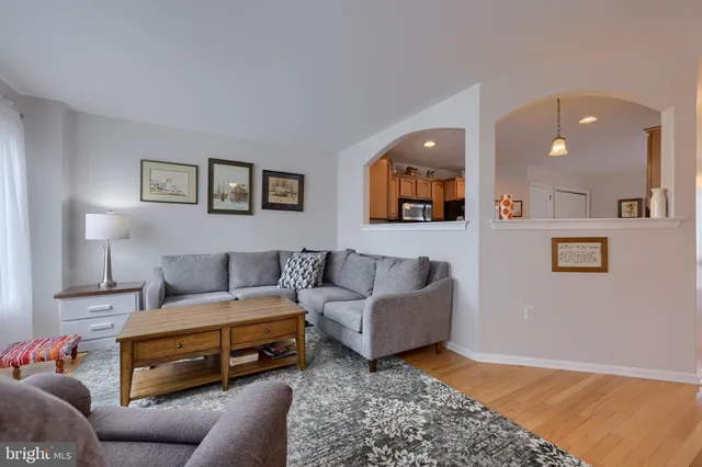a bedroom with furniture and painting on the wall