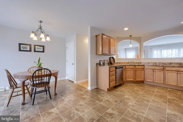 a kitchen with a cabinets and chairs