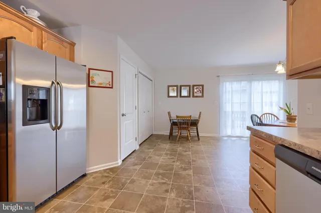 a kitchen with stainless steel appliances a refrigerator and a sink