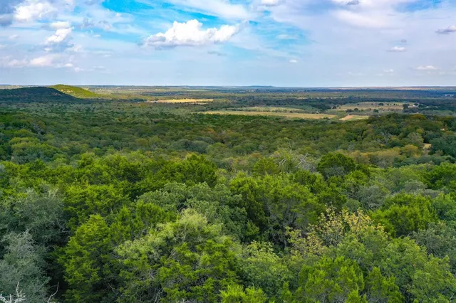 a view of an ocean and a mountain
