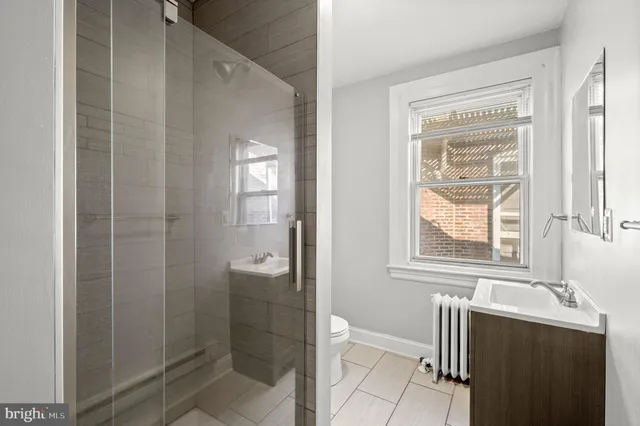 a bathroom with a bathtub and shower