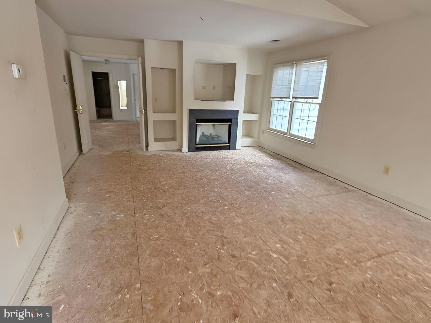 2103 Parkside Drive Bowie, MD 20721 - Photo 32 of 32 a view of an empty room with a window and fireplace