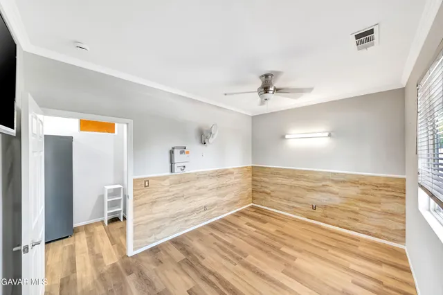 a bathroom with a sink a mirror a toilet and shower