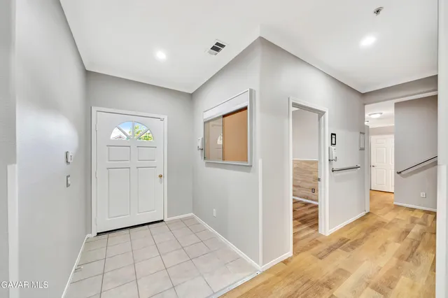 a view of a kitchen with a refrigerator
