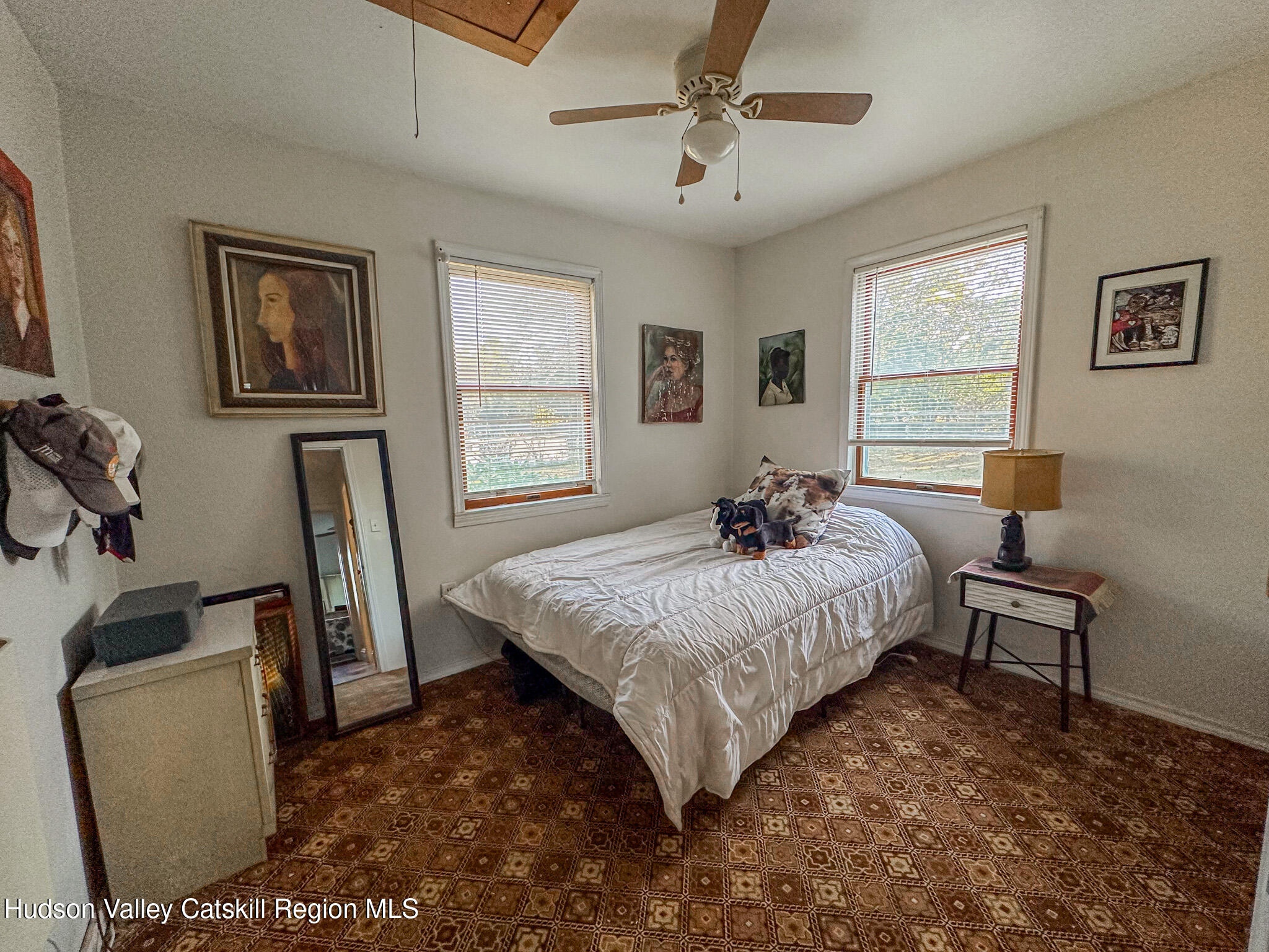 91 Drake Hill Road Greenville, NY 12431 - Photo 13 of 28 a bedroom with a bed a dresser and chair